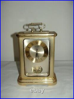 Ancienne Pendule Quartz Rhythm Avec Pendule Rotative En Laiton