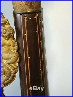 Ancienne pendule colonne en bois de placage à décor marqueté