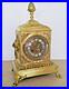 Ancienne-pendule-en-metal-type-bronze-avec-ornementations-01-ezb