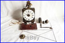 Ancienne pendule horloge comtoise fonction réveil décor soleil XVIIIé ref 520