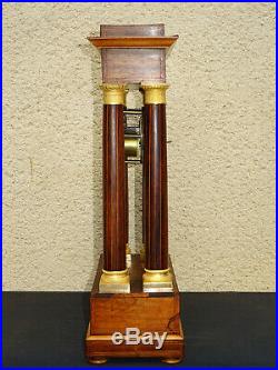 Ancienne pendule portique d'époque Charles X, Antique gilt clock