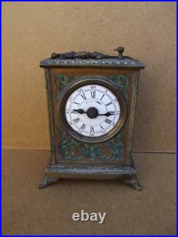 Ancienne pendule réveil d officier en bronze décors lithographier de chiméres