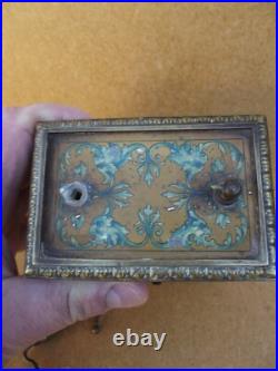 Ancienne pendule réveil d officier en bronze décors lithographier de chiméres