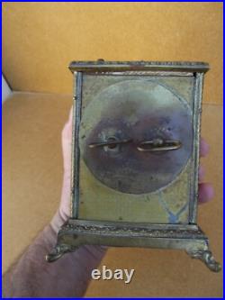 Ancienne pendule réveil d officier en bronze décors lithographier de chiméres