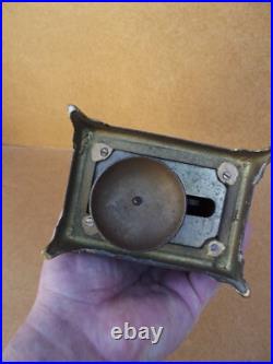 Ancienne pendule réveil d officier en bronze décors lithographier de chiméres