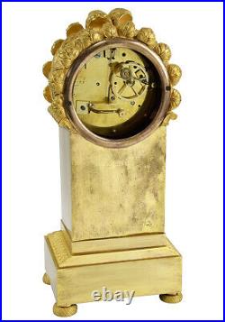 BIBLIOTHEQUE KINABLE. Kaminuhr Empire clock bronze horloge antique pendule uhren