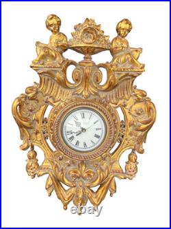 Cartel forme écusson de Style L XVI doré/Horloge