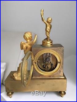 Exceptionnelle mini pendule bronze doré 19eme