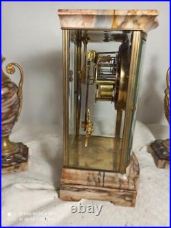 Garniture pendule cage et cassolettes marbre, bronze dore fonctionne sonne
