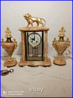 Garniture pendule cage et cassolettes onyx, bronze dore fonctionne sonne