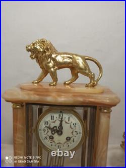 Garniture pendule cage et cassolettes onyx, bronze dore fonctionne sonne