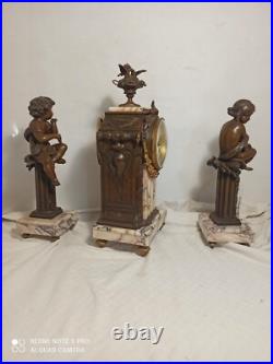 Garniture pendule et putti en pendant(Moreau) marbre et regule fonctionne sonne