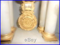 Grande pendule portique style empire albatre et bronze dore fonctionne sonne