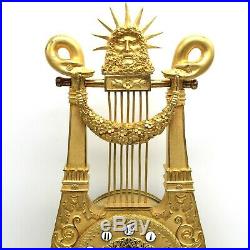Horloge Pendule Lyre d'époque Empire en Bronze dorè du 19ème siècle