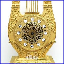 Horloge Pendule Lyre d'époque Empire en Bronze dorè du 19ème siècle