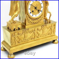Horloge Pendule d'époque Empire en Bronze doré du 19ème siècle