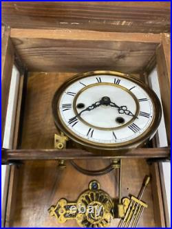 Horloge murale ancienne en bois avec ange dans son jus à restaurer très ancien