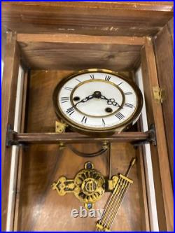 Horloge murale ancienne en bois avec ange dans son jus à restaurer très ancien