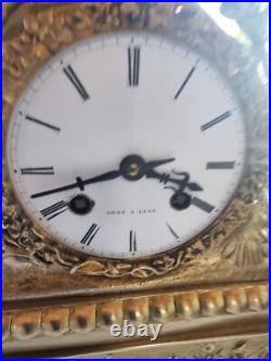 Horloge, pendule bronze doré, début XIXe