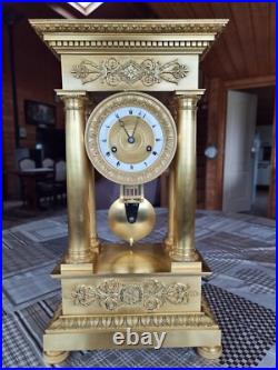 Horloge, pendule bronze doré, empire, balancier au couteau
