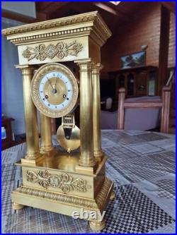 Horloge, pendule bronze doré, empire, balancier au couteau