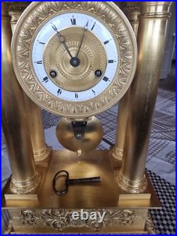 Horloge, pendule bronze doré, empire, balancier au couteau