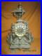 Jolie-pendule-ancienne-en-metal-decor-animaux-fantastiques-guirlandes-Marti-01-ls