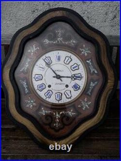 Oeil de Boeuf Pendule Horloge émaillée en bois noirci Landais à Quelaines France