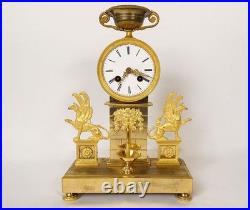Pendule Empire bronze doré griffons ailés fontaine mascaron faune coupe 19è