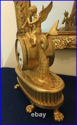 Pendule Eros au Dauphin en bronze ciselé et doré Epoque XIXème siécle