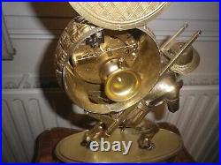 Pendule bronze doré portefaix