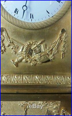 Pendule bronze dorépatiné époque empire au thème du berger musicien