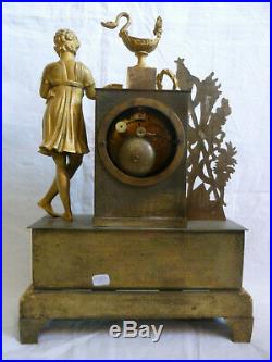 Pendule bronze restauration allegorie de la lecture et du savoir 19emme