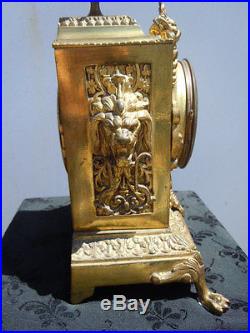 Pendule cartel bronze décor têtes lions d'époque 19ème