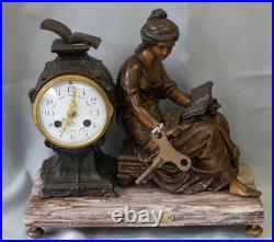 Pendule en régule MOREAU la liseuse sur marbre chiné Pendule en régule MOREAU la liseuse sur marbre chiné