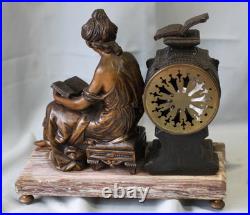 Pendule en régule MOREAU la liseuse sur marbre chiné Pendule en régule MOREAU la liseuse sur marbre chiné