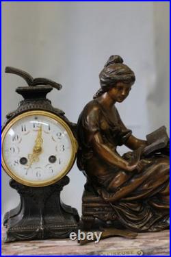 Pendule en régule MOREAU la liseuse sur marbre chiné Pendule en régule MOREAU la liseuse sur marbre chiné