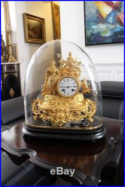 Pendule en régule doré sous globe verre soufflé XIXe Napoléon III