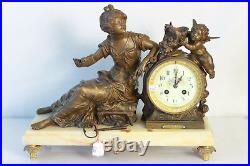 Pendule en régule sur marbre décor de femme et putto Moreau clock