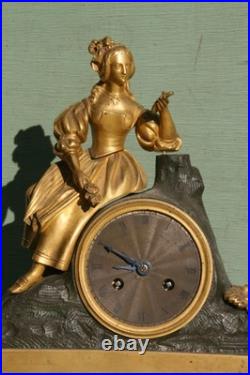 Pendule époque restauration à fil bronze