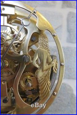 Pendule mouvement squelette brocot avec silhouette de femme dénudée, clock