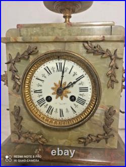 Pendule onyx et et decos bronze fonctionne sonne
