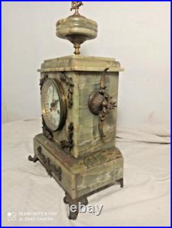 Pendule onyx et et decos bronze fonctionne sonne