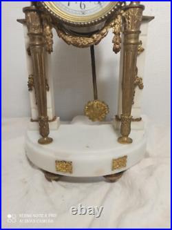 Pendule portique marbre blanc et bronze dore fonctionne sonne