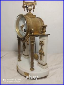 Pendule portique marbre blanc et bronze dore fonctionne sonne