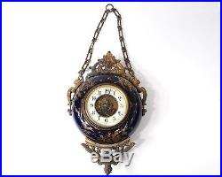 Pendule ronde oeil de boeuf bronze doré céramique émaillée Napoléon III 19è