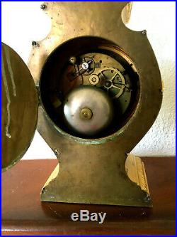 Pendule tête de poupée XIXeme en bronze doré. Réveil et sonnerie au passage