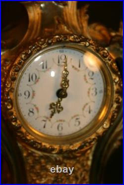 Petite pendule en bronze style louis XV vers 1900