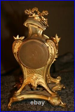 Petite pendule en bronze style louis XV vers 1900