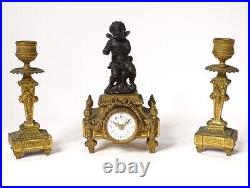 Petite pendulette bougeoirs bronze doré angelot fleurs noeud clock XIXème